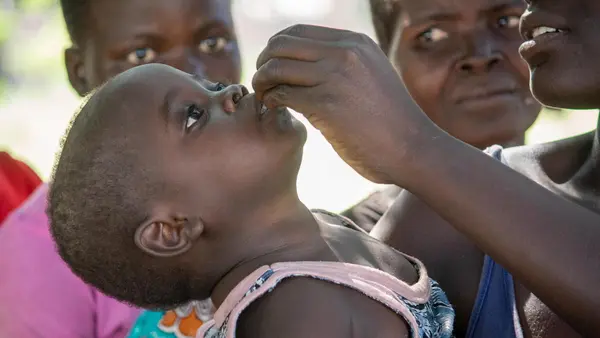 A child receives a cholera vaccine during a UNICEF-supported immunization campaign in Chikwawa district, Malawi.