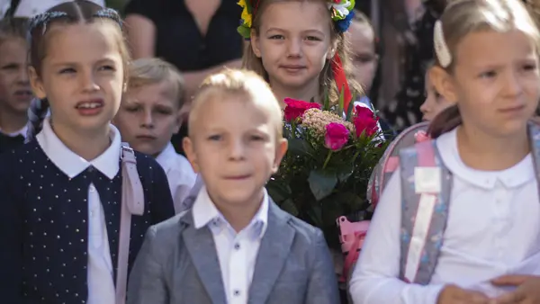 Seven-year-old Emilia, from Irpin, Ukraine, wore flowers in her hair on the first day of school at Januscz Korczak School #12 in Krakow, Poland on Sept. 1, 2022.