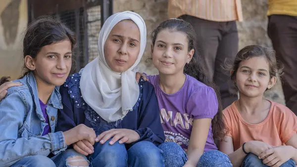 Four girls in a UNICEF-supported accelerated learning program for students who've missed out on school