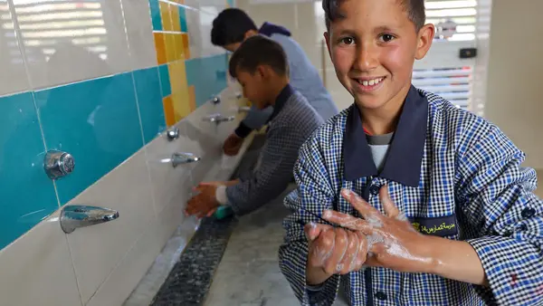 Students wash their hands in the new UNICEF-sponsored sanitary block at Mars Elementary School in Kesra, Tunisia.