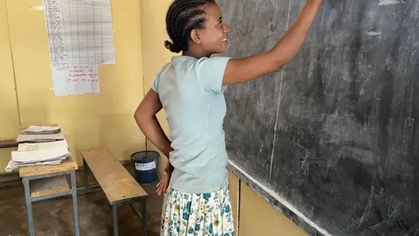 Thirteen-year-old Emyte writes her class assignment on the blackboard in Ethiopia's Amhara Region. 