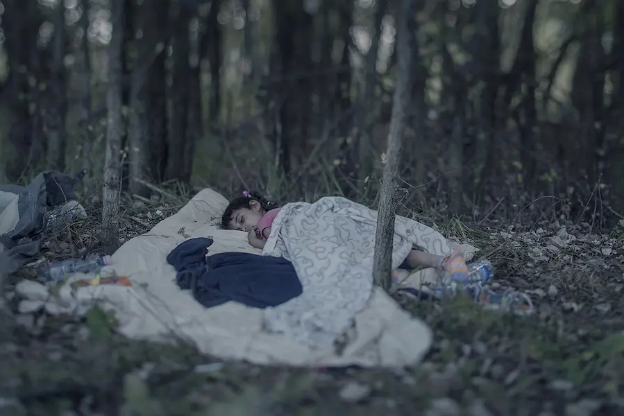 Lamar, from Baghdad, sleeps on a blanket in a forest in September 2015. After two attempts at crossing the sea from Turkey in a small dinghy, her family reached Serbia, only to find the Hungarian border closed. Lamar, from Baghdad, sleeps on a blanket in a forest in September 2015. After two attempts at crossing the sea from Turkey in a small dinghy, her family reached Serbia, only to find the Hungarian border closed.