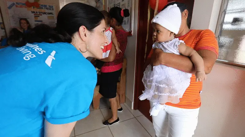 Woman Playing with Smiling Baby