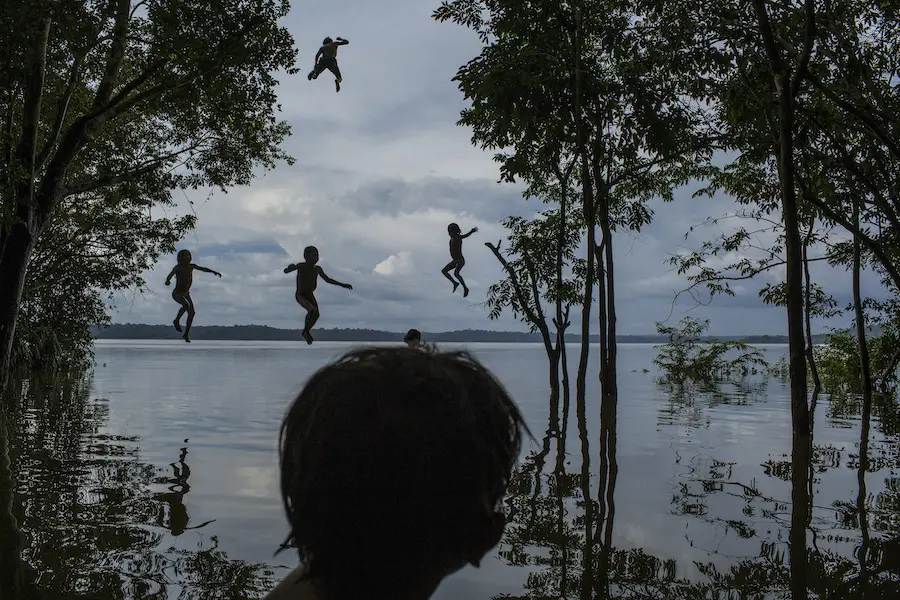 Children play in the Tapajós River, home to the Munduruku people, in the Brazilian Amazon on February 10, 2015. Construction plans threaten to displace the community. Children play in the Tapajós River, home to the Munduruku people, in the Brazilian Amazon on February 10, 2015. Construction plans threaten to displace the community.