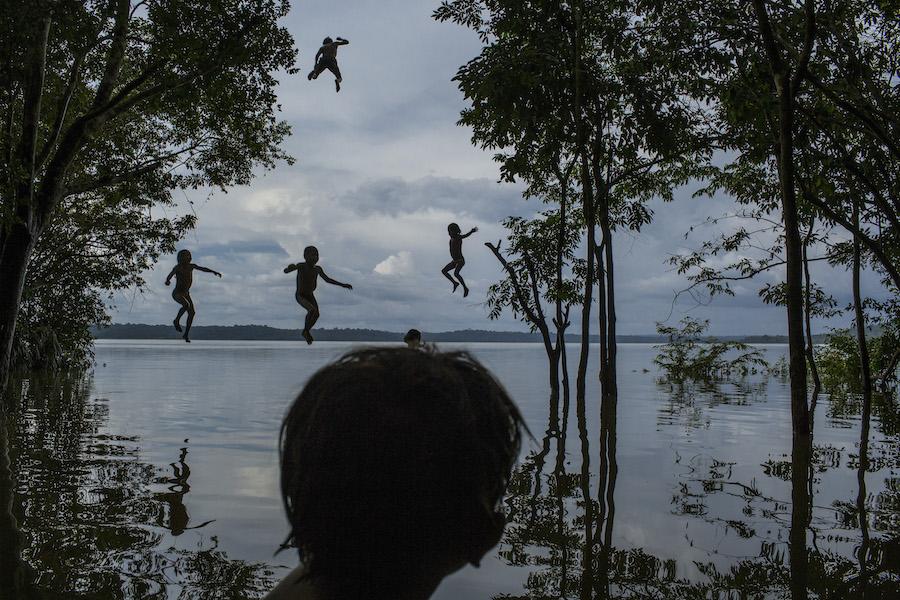Children play in the Tapajós River, home to the Munduruku people, in the Brazilian Amazon on February 10, 2015. Construction plans threaten to displace the community.