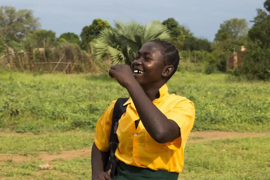 Josephine Bakhita, 16, is happy that her UNICEF-supported school has reopened in Torit, South Sudan, after shutting down to prevent the spread of the novel coronavirus. Josephine Bakhita, 16, is happy that her UNICEF-supported school has reopened in Torit, South Sudan, after shutting down to prevent the spread of the novel coronavirus.