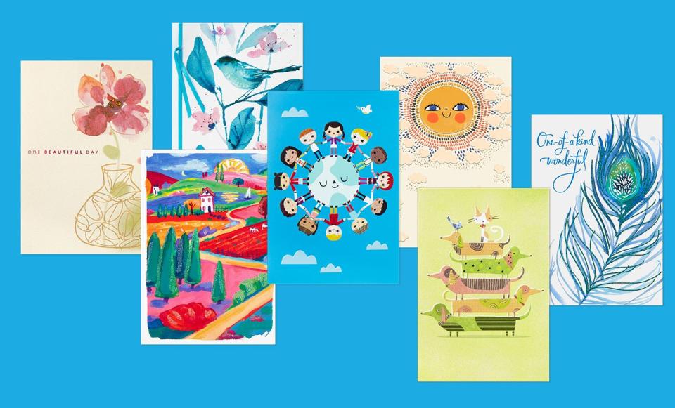 A selection of colorful greeting cards on a bright blue background