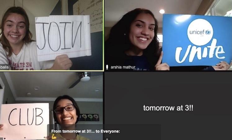 3 student club members holding up signs during a video chat