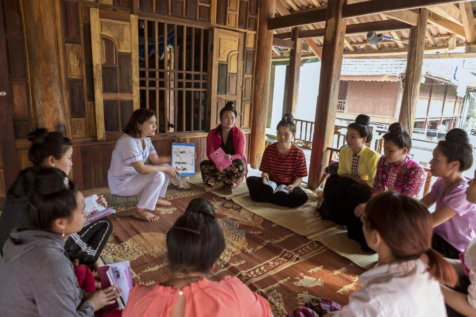 Chief nurse Lo Thi Tinh (left) has worked for over ten years at the Na Son commune health center in Vietnam, facilitating regular community group discussions on antenatal and prenatal care for the Community Integrated Early Childhood Development Club.