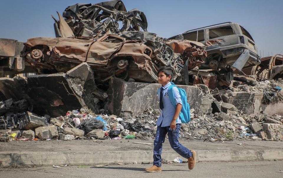 On September 26, 2018, in West Mosul, Iraq, neighbors Ali, 11, and Farah (not pictured), 13, attend the UNICEF-supported Ithar School which runs a shift for boys and a shift for girls. During the last war, both children dropped out of school. "I feel sad when I see the destruction on my way to school but I am happy because we have returned to school this year,” says Ali “I wish we never see those days again.” “There is no life without school,” Farah says. She likes math and wants to become an engineer.