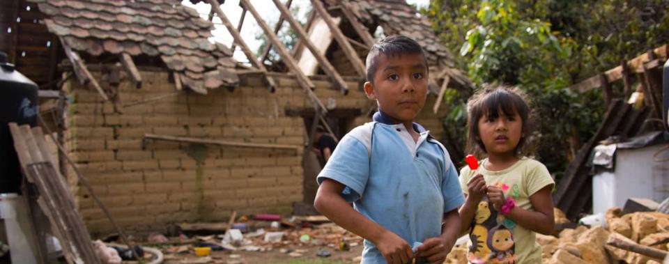 Iker, 9, and his sister Yeimire, 6, stand outside their home which was destroyed in an earthquake in San Andrés Hueyapan, Tetela del Volcán municipality, Morelos, Mexico