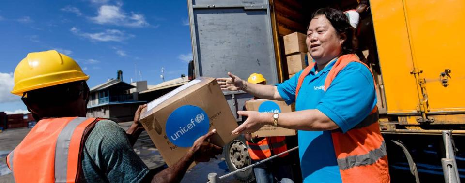 Workers loading a truck with UNICEF supplies