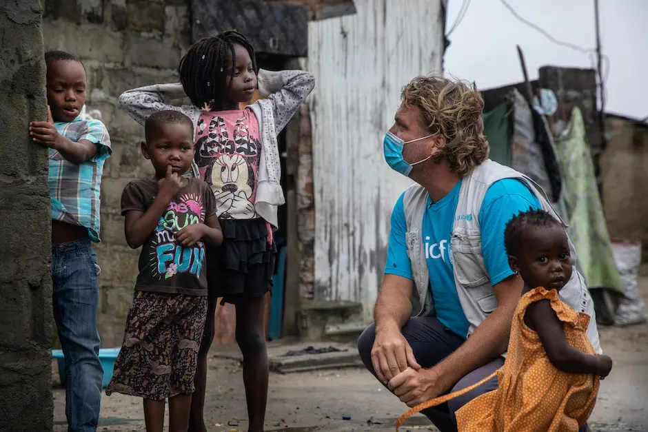 Daniel Timme, Chief of Communications for UNICEF Mozambique, checks in with families in the Praia Nova neighborhood of Beira, Mozambique, as Cyclone Eloise bears down on the area.