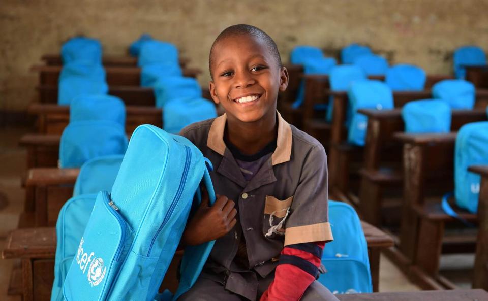 Daniel, a 9-year-old student, holds his new UNICEF backpack. He goes to a UNICEF-supported school in Maroua, a town in northern Cameroon.
