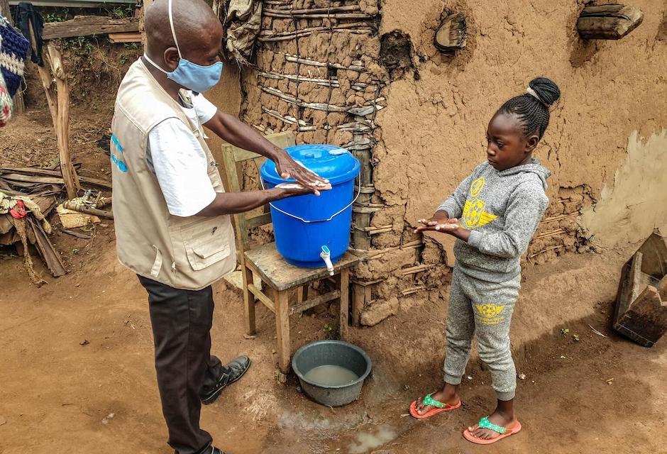 8-year-old Laetitia washes her hands during a UNICEF-supported campaign focused on disease prevention in Butembo, North-Kivu province