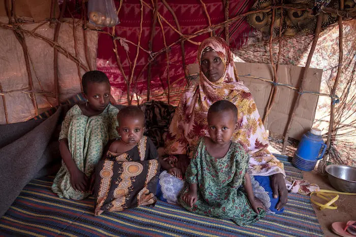 Faduma, 30, and her three children, Hamdi, Najmo and Nasteh, at a UNICEF-supported camp for displaced persons in Dollow, Somalia