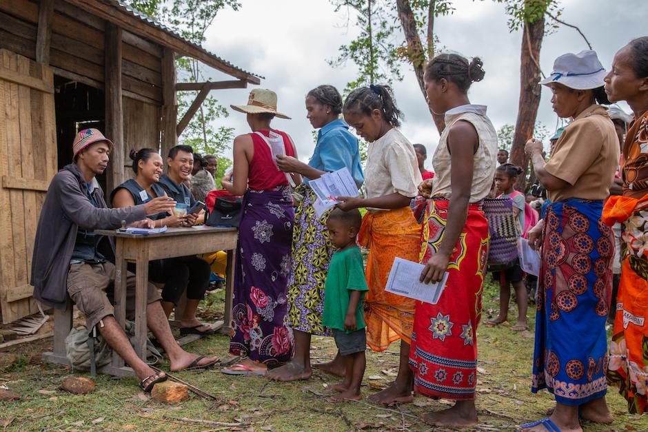 Families in Madagascar queue to receive cash payments as part of a UNICEF social protection program aimed at breaking the cycle of poverty.
