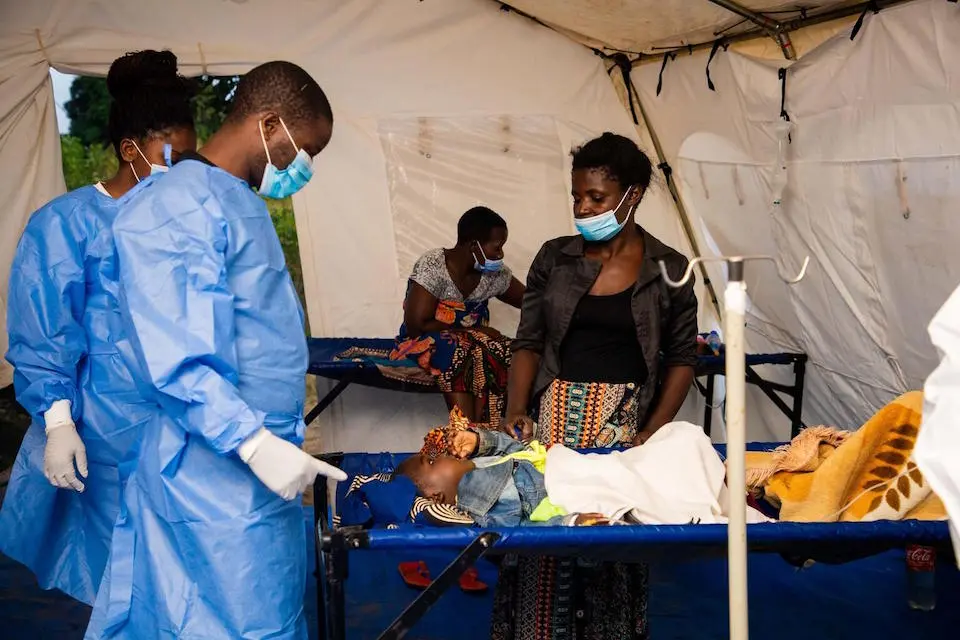 Health workers tend to a young patient at Tukombo Health Center in Nkhatabay, Malawi.