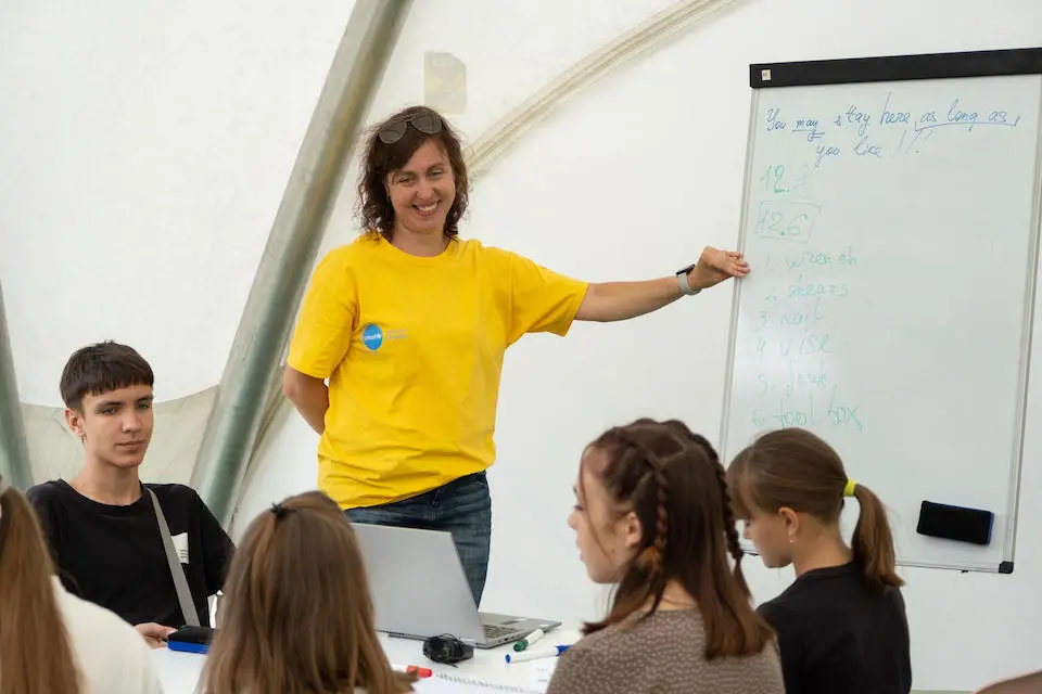 In August 2022, teenagers displaced by the war study English at a UNICEF Spilno center in Kropyvnytskyi, Ukraine.