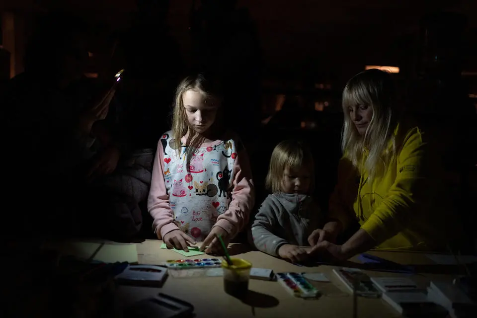 Children play at a Spilno center at a metro station in Kharkiv, Ukraine, while air raids, electricity cuts and attacks on the city continue around them.