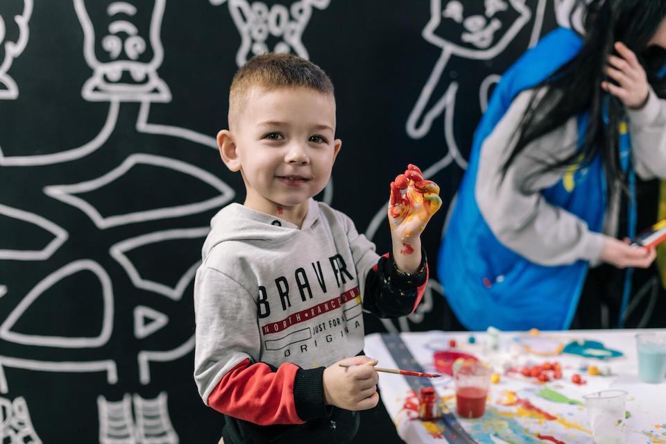 A boy paints at a UNICEF Spilno center in Odessa, Ukraine. 