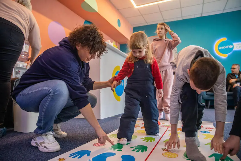 Children play a game at a newly opened UNICEF Spilno center in Vyshgorod, Ukraine, on Feb. 11, 2023.