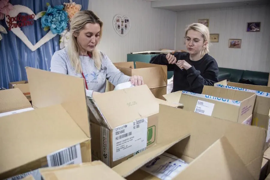 Staff operating a maternity ward in the basement of Ukraine's Kyiv Regional Perinatal Center unpack urgent supplies delivered by UNICEF in March 2022.