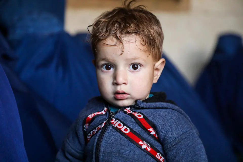 Sajeed, 2, accompanied his mother to Parun city in Afghanistan's Nuristan province to receive cash assistance from UNICEF.