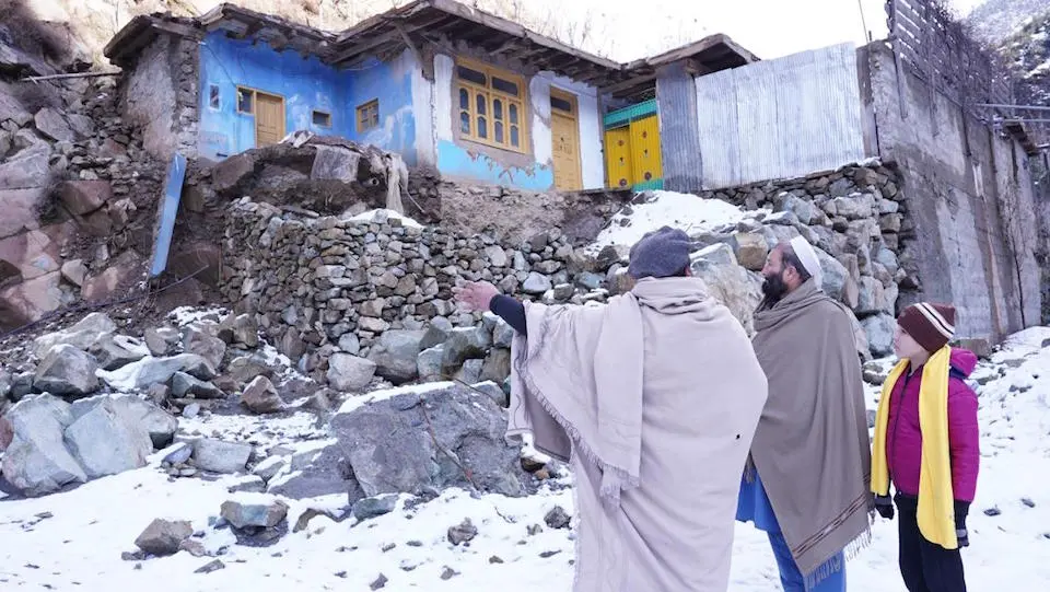 Noorullah’s grandfather and father point out how Pakistan's 2022 floods damaged their house and the section they managed to rebuild.