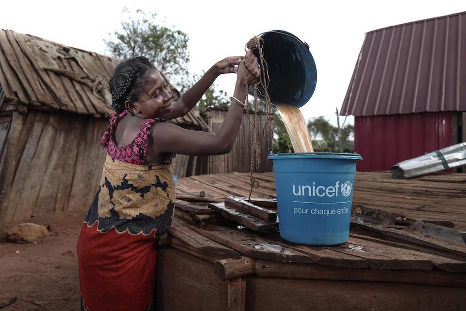 A pregnant woman in Madagascar's Ambovombe district, in the Androy region, makes use of a UNICEF-provided water, sanitation and hygiene kit to purify water for safe use.