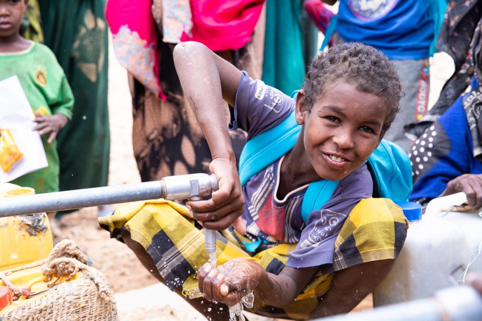 A child drinks from a tap at Barilays IDP site where UNICEF provides water to drought-affected communities, Somali region Ethiopia.