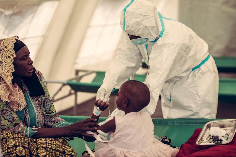 A child in Malawi receives cholera treatment from a health worker at the Chilumba rural hospital.