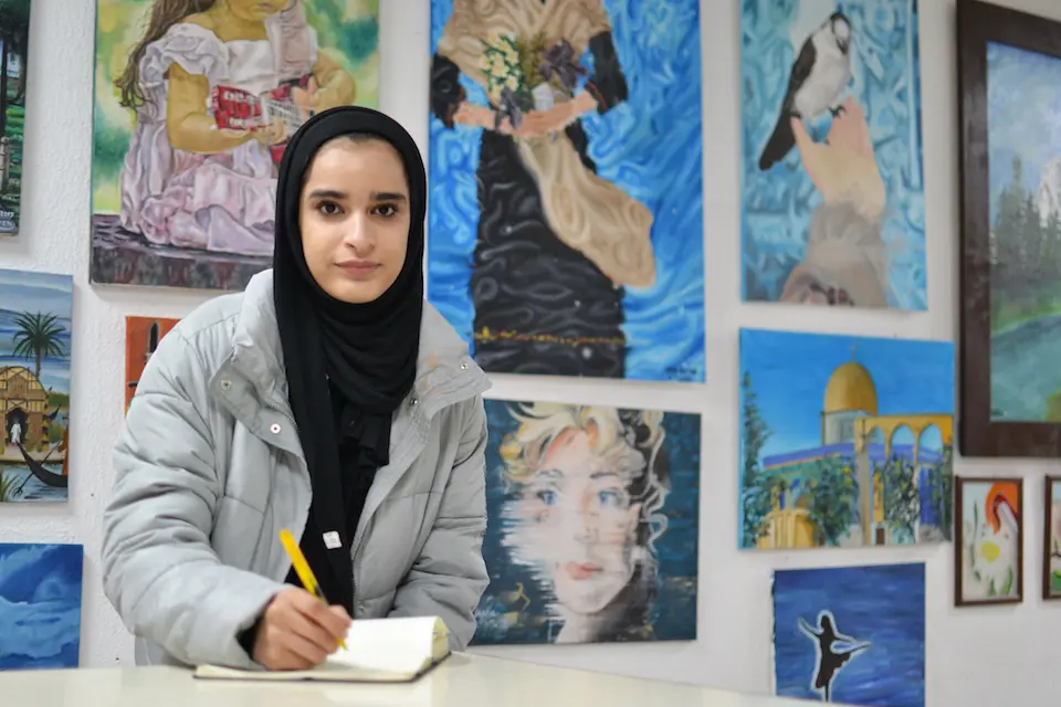 Asma, 16, a refugee from Iraq, takes classes at the UNICEF-supported Makani center in East Amman, Jordan.