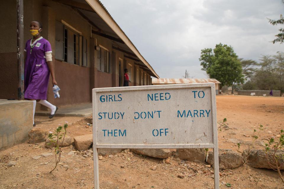 A sign at the Kalas Girls Primary School in the Amudat District of Uganda encourages parents to value the education of their daughters more than the “bride price” they receive from marrying them off.