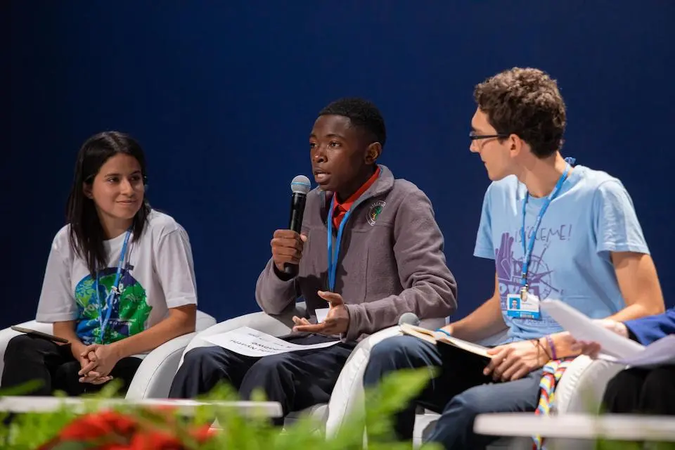 A youth activist from Zimbabwe participates in a panel discussion about climate change and child rights at a conference in Madrid, Spain.