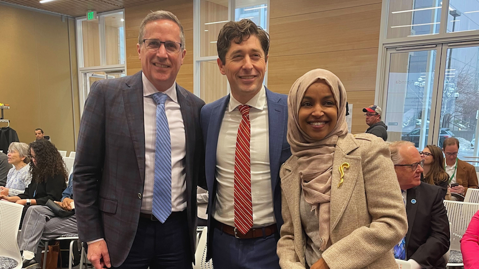 From left: UNICEF USA President and CEO Michael Nyenhuis, Minneapolis Mayor Jacob Frey and Congresswoman Ilhan Omar celebrate the official launch of the Minneapolis CFCI Local Action Plan at the CFCI Candidate Ceremony on Feb. 14, 2023.