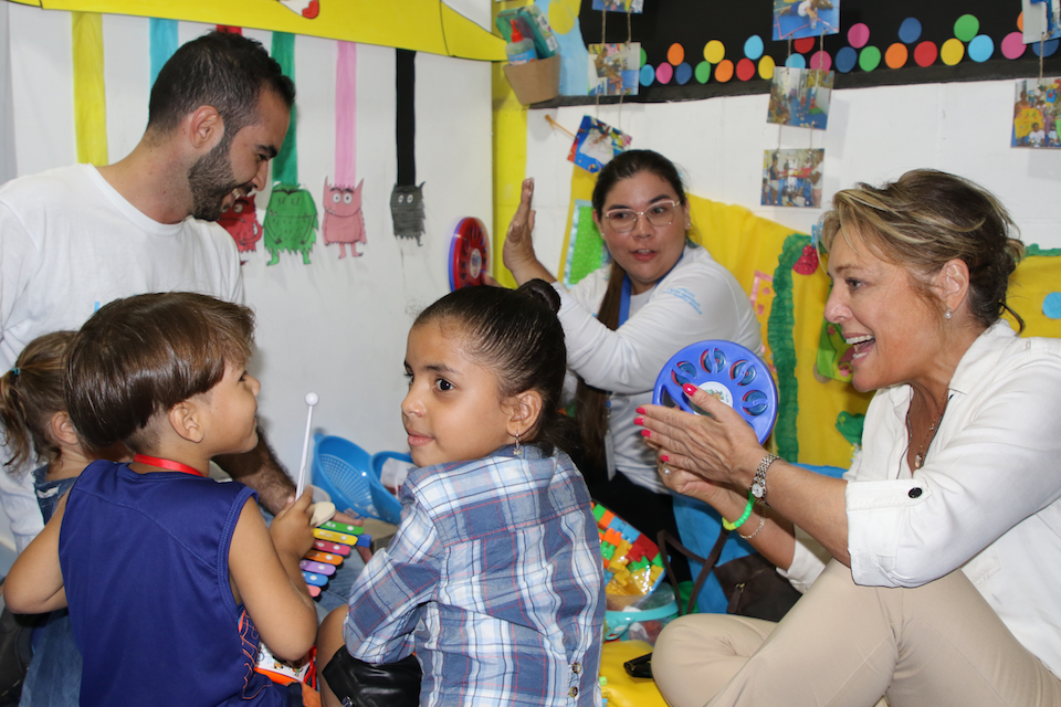  Children play a game with UNICEF staff and Education Cannot Wait Executive Director Yasmine Sherif, far right, at the PIO center in Cúcuta, Colombia.