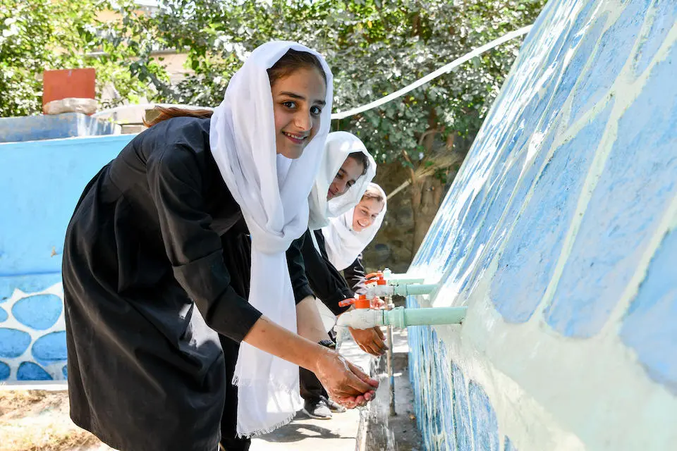 Girls washing their hands at the playground of the Haleema Sadia High School in Faizabad, Badakhshan a northeast province of Afghanistan.