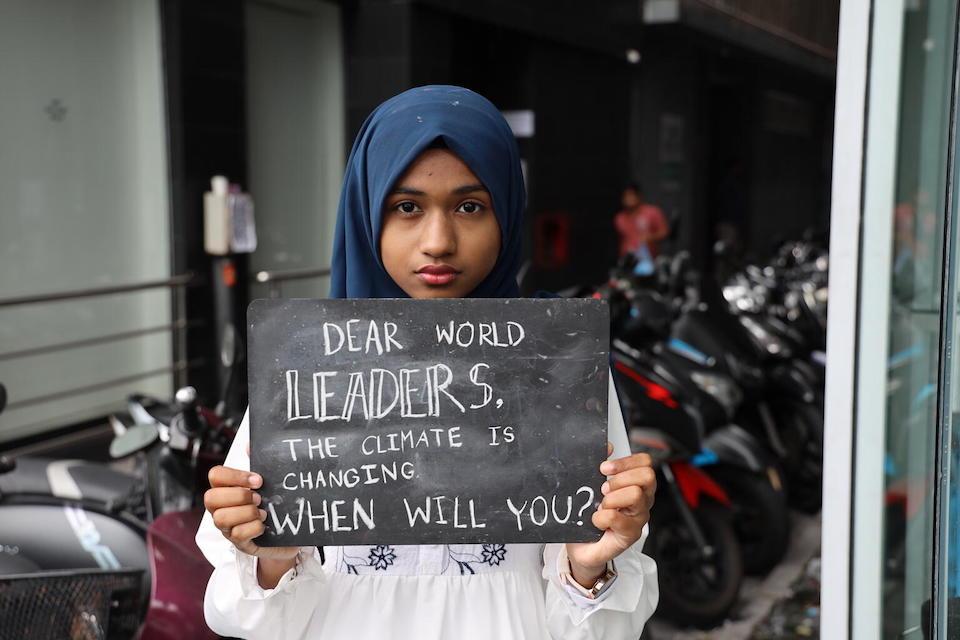 In October 2022, 15-year-old Yumnu joins other young people from Maldives, Sri Lanka and Bangladesh in a demonstration in Malé, Maldives, hosted by the government in partnership with UNICEF.