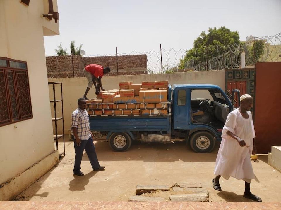 On April 25, 2023, essential health and nutrition supplies destined for El Fasher, North Darfur, are carefully loaded into a truck in Sudan.