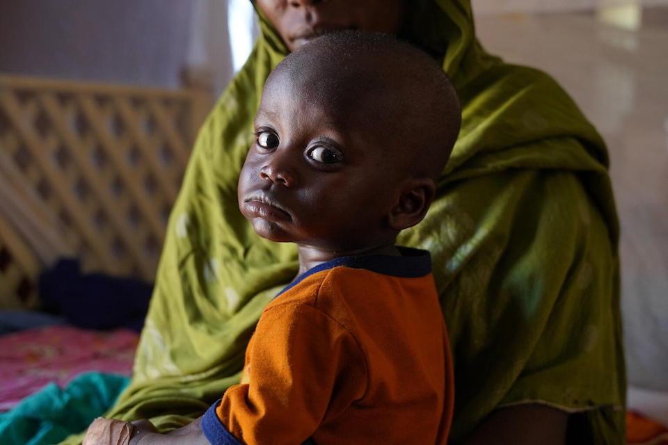 On May 2, 2023, a mother brings her young child to a UNICEF-supported nutrition center for a screening.