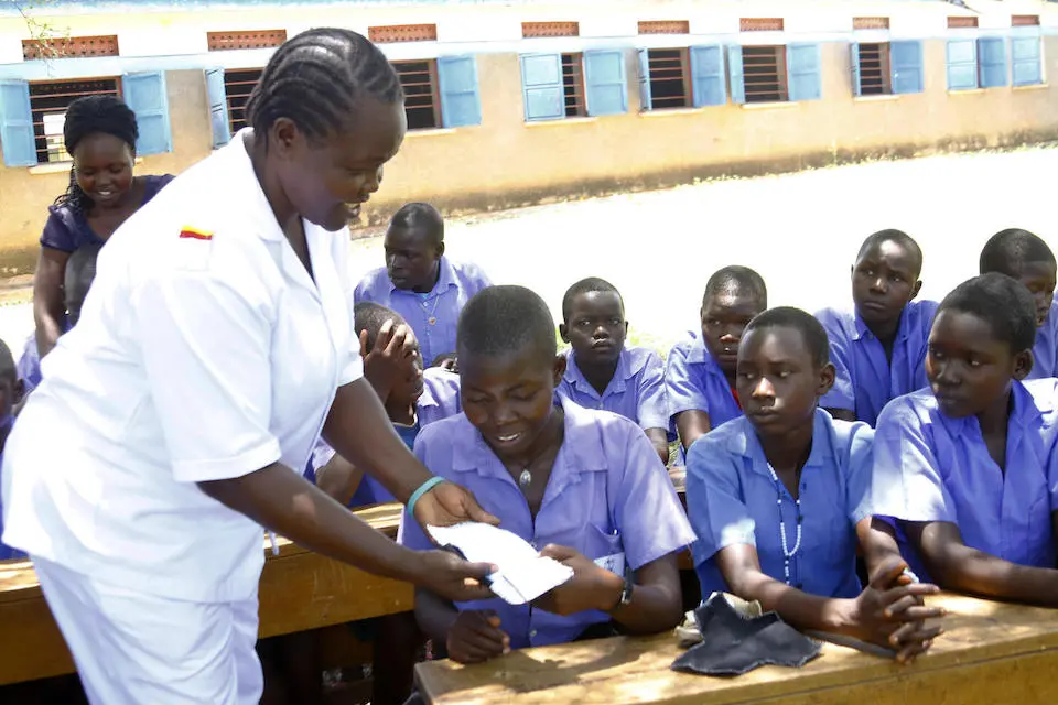 Primary school students in Ajugopi Primary School in the Adjumani district in Northern Uganda learning how to make re-usable pads during a UNICEF-supported menstrual hygiene management session.