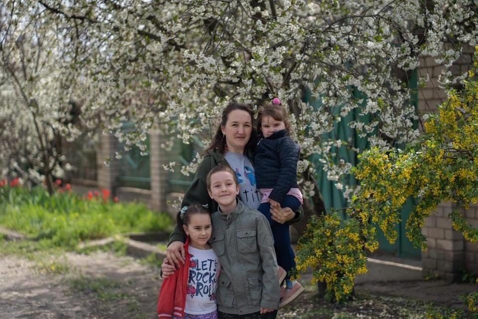 Mother of five children Yevhenia with her three younger children in Kherson, southern Ukraine.
