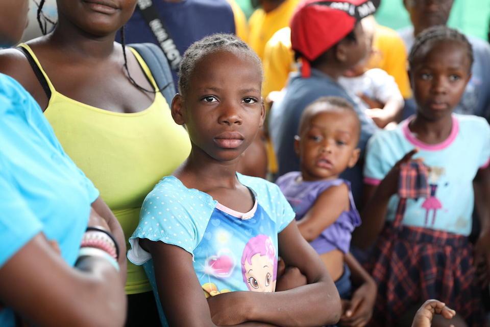 Families gathered at a UNICEF-supported site for those displaced by violence in Tabarre, Haiti.
