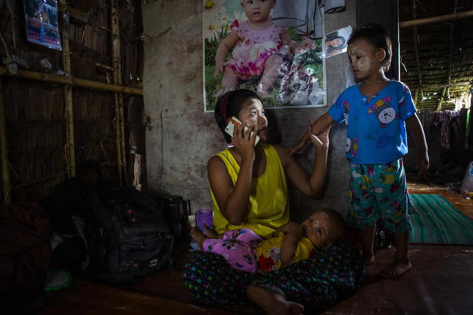 Ma Thin Yamone, 20, of Yangon, Myanmar, receives health counseling via mobile phone from her family doctor as part of a UNICEF-supported program.