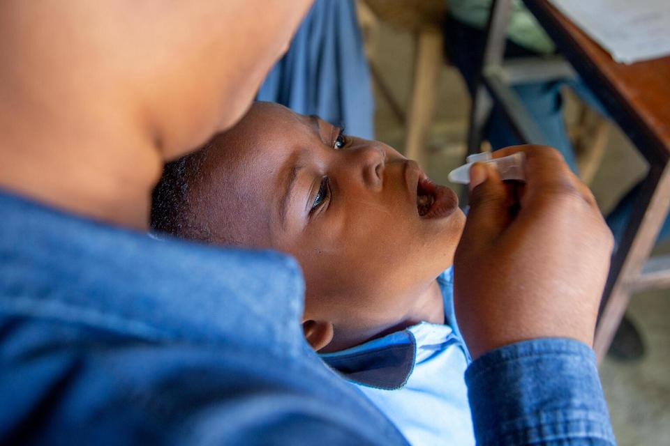 A child receives an oral cholera vaccine during a UNICEF-supported campaign in Mirebalais, Haiti.