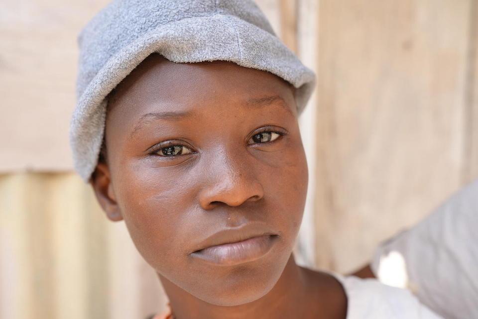 Virginia, 13, of Port-au-Prince was injured when a stray bullet pierced the wall of her home.