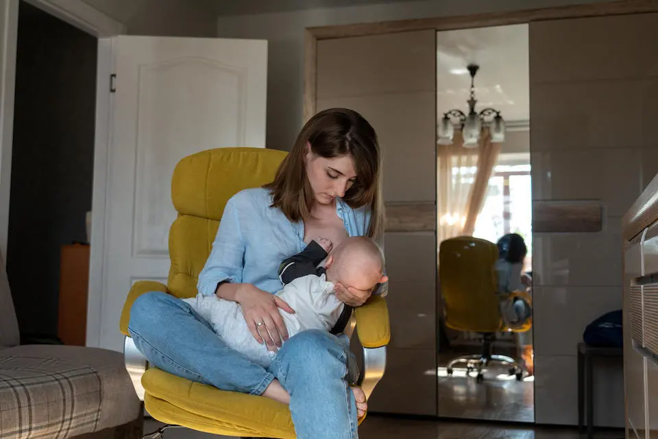 Yevheniya, 29, breastfeeds her 6-month-old son, Yehor, in Ukraine.
