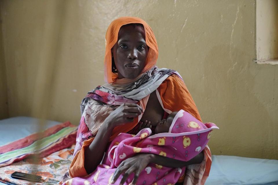 A mother breastfeeds her child who was admitted with severe acute malnutrition and medical complications at Elfashier stabilization center in Sudan.