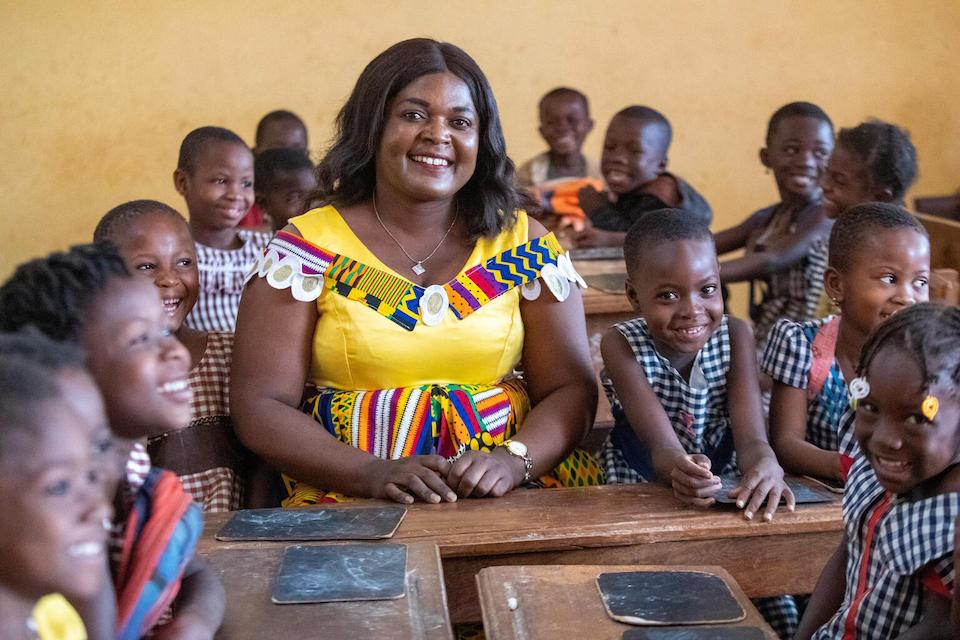 Yao Adjoua Rose, a primary school teacher in Touba, northwestern Côte d'Ivoire, in her classroom surrounded by young students..